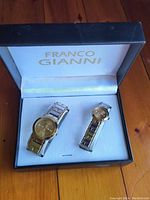 Photo of Franco Gianni his and hers watch set in box, showing gold-tone faces and mixed metal link bands