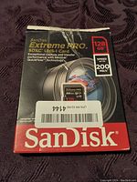 Photo of the front retail packaging showing SanDisk Extreme Pro SDXC UHS-I card with 128GB capacity and speed up to 200MB/s.