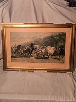 Full view of framed print showing entire artwork and frame with visible damage.