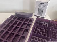 Dark purple silicone Perfect Petites mold, waffle mold, and boxed insulated food jar thermos