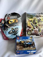 Overview of the three toy sets including LEGO Ninjago, Mega Bloks alien robot, and LEGO City police vehicle