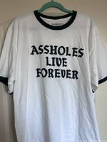 Front view of white men's XL graphic T-shirt with green text and sleeve rings