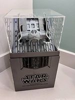 Star Wars TIE Advanced X1 battle drone displayed in clear plastic case on its box branding