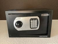 Front view of the closed Honeywell firearm safe showing the keypad and handle.
