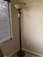 Floor lamp alone unlit, showing overall height and details of base and stem.