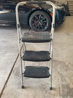 3-step black and silver step ladder with non-slip steps