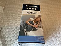 Box of Montauk weighted throw blanket showing package with weight and dimensions.
