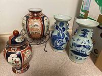 All four porcelain vessels arranged on floor