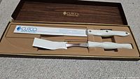 Full view of boxed Cutco carving set with two knives in fitted case