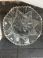Top-down view of clear vintage Federal Glass bowl showing detailed star pattern and scalloped rim