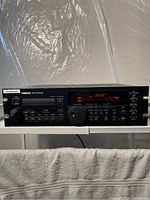 Front view showing unit powered on, LED display reading 00:00.