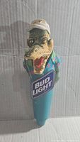 Front view of Bud Light Miami Gator draft beer tap handle showing detailed alligator figure wearing white cap and blue floral shirt with Bud Light logo base.