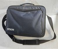 Black Epson-branded carrying case with shoulder strap and zippered compartments
