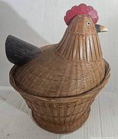 Side angled view of the wicker chicken basket showing the tail and body weave detail