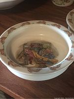 Front view of oatmeal bowl showing colorful bunny kitchen illustration and rim rabbit decoration