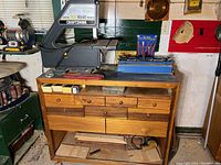 Band saw installed on wooden cabinet showing full lot