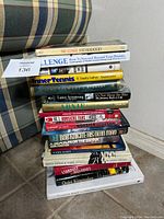Photo showing stacked biographies including Bill Cosby's Fatherhood and Lance Armstrong's It's Not About the Bike.