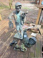 All five figurines arranged on wooden deck