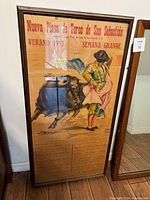 Close-up front view of the bullfighter poster showing the matador, bull, and event details.