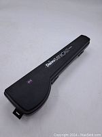 Closed black hard plastic carrying case with Daiwa Minicast branding.