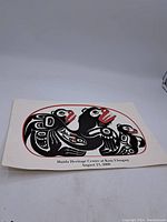 Full view of the Haida print on white paper showing Haida figures and text.