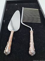 Both servers on black foam background, left the triangular blade server and right the comb server