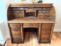 Front view open showing interior small drawers and seven exterior drawers