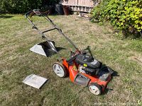 Three-quarter front view of mower on grass