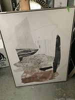 Large framed abstract print with textured neutral shapes, line work, and some color accents, showing damage and wear.