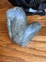 Left side view of the walrus soapstone sculpture showing overall shape and side profile.