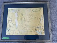Full view of framed and matted Chagall Passover scene print with silver frame and dark blue matting.