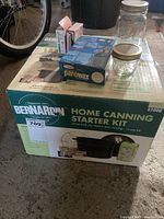 Bernardin Home Canning Starter Kit box with included accessories, two glass jars, and additional boxes.