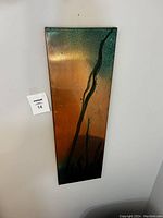 Front view of the rectangular copper wall art showing gradient patina and abstract lines.