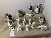 Overhead view of all porcelain figurines arranged on burlap