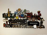 Full front view of the train wall sign showing the entire width including locomotive and railroad signs.