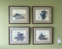 Four framed prints arranged in a 2x2 grid showing maritime coastal themes with boats and docks