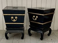 Front view of two planters on stands against wall