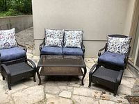 Full set: loveseat, two chairs, two ottomans, coffee table with cushions