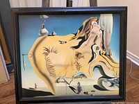 Full view of framed painting hung on wall