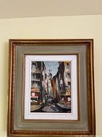 Front view of entire framed oil painting showing subject and frame