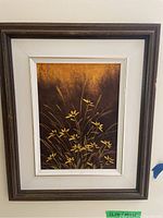 Full view of framed original painting showing yellow flowers and grasses on textured brown and orange background.