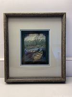 Framed painted slate artwork displayed against a wall, showing full piece including rustic wood frame and matte.