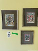 Three framed paintings hanging on wall, showing all lot contents