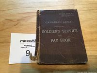 Front cover of the soldier's service and pay book showing the title and condition.