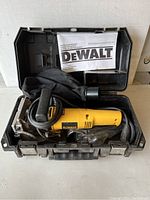 DeWalt DW682 biscuit joiner tool in black plastic case with manual and dust bag