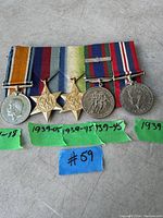 Five mounted campaign medals on ribbon bar: British War Medal 1914–18, 1939–45 Star, Atlantic Star, Canadian Volunteer Service Medal and War Medal 1939–45