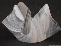 View of the art glass bowl showing the handkerchief folded swirl shape and color ribbons.