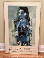 Full front view of the plak art reproduction depicting Picasso's Jacqueline Sitting with Cat with signature and exhibition text.
