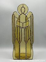 Image showing the full front of the stained glass angel, highlighting the handblown yellow textured glass and lead frame design