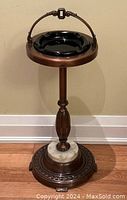 Full view of the vintage ashtray stand showing the black glass ashtray on top and marble accent on the base.